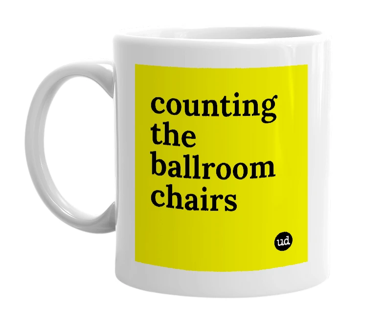 White mug with 'counting the ballroom chairs' in bold black letters