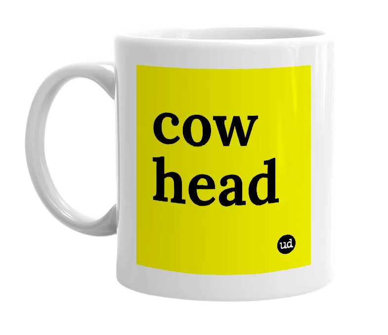 White mug with 'cow head' in bold black letters