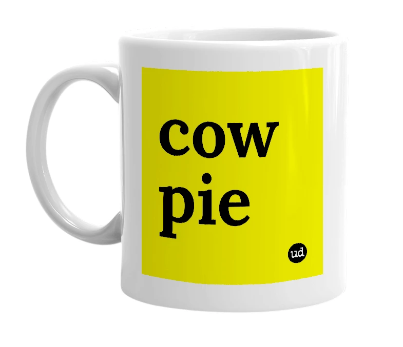 White mug with 'cow pie' in bold black letters