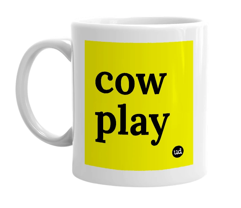 White mug with 'cow play' in bold black letters