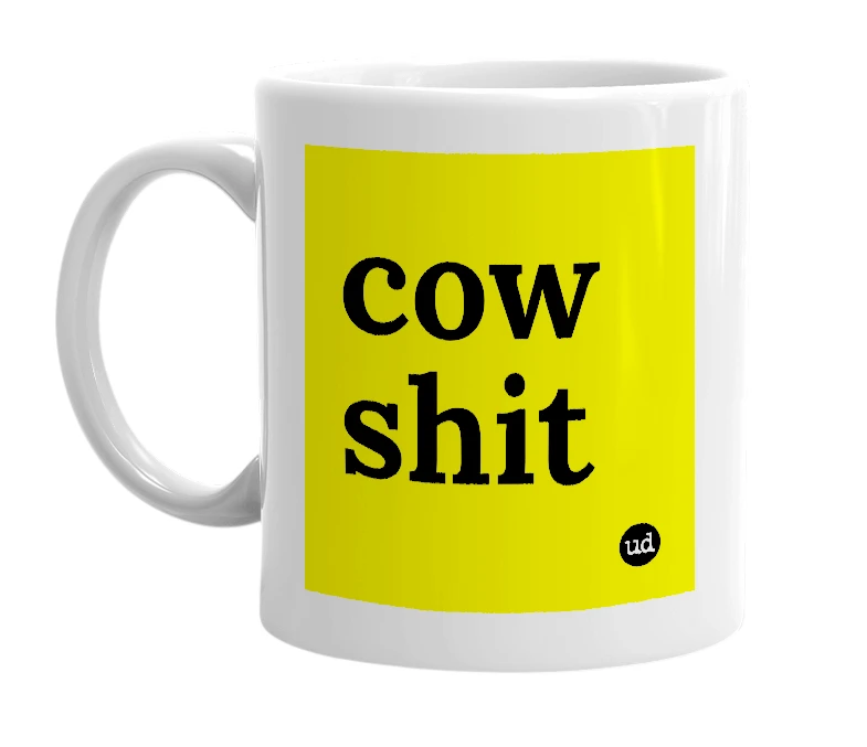 White mug with 'cow shit' in bold black letters