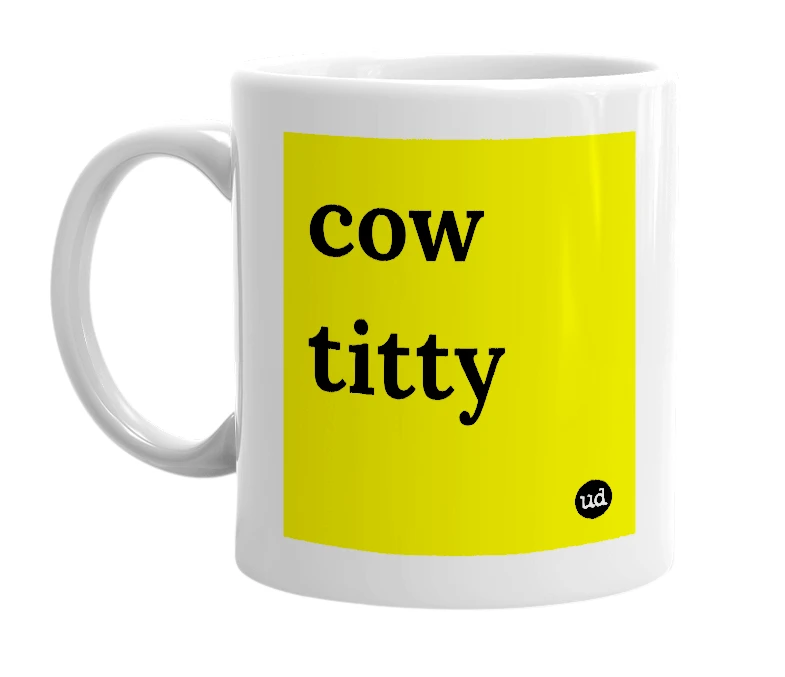 White mug with 'cow titty' in bold black letters