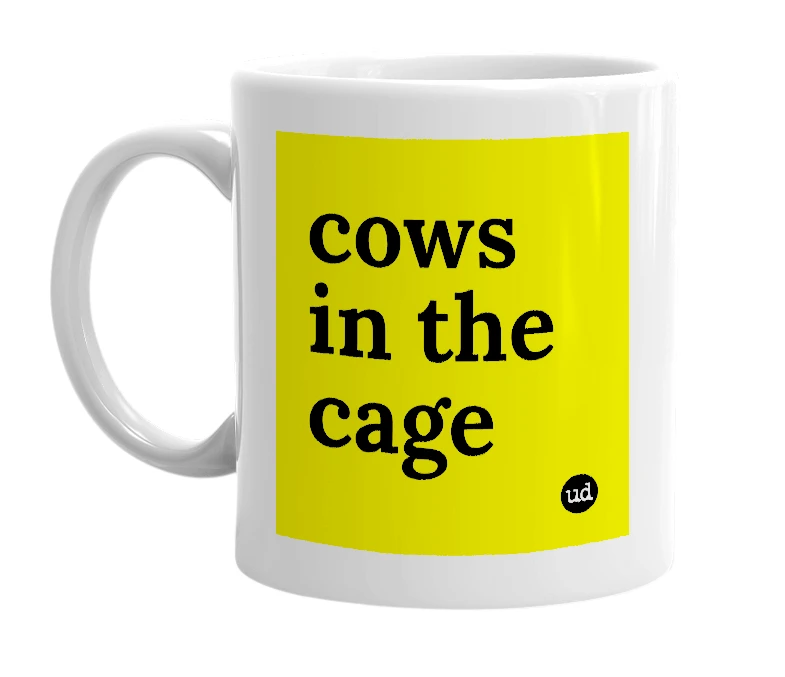 White mug with 'cows in the cage' in bold black letters