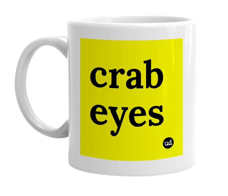 White mug with 'crab eyes' in bold black letters