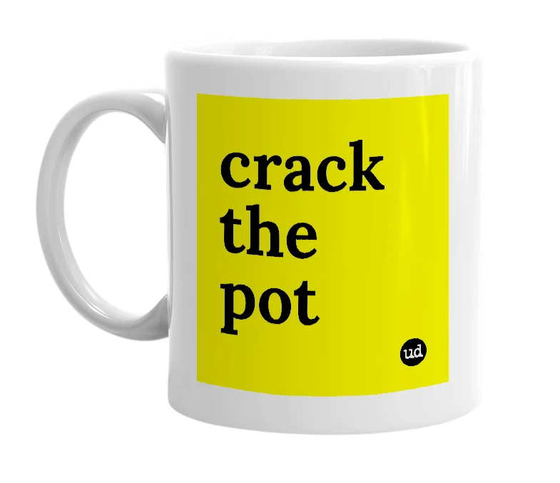 White mug with 'crack the pot' in bold black letters