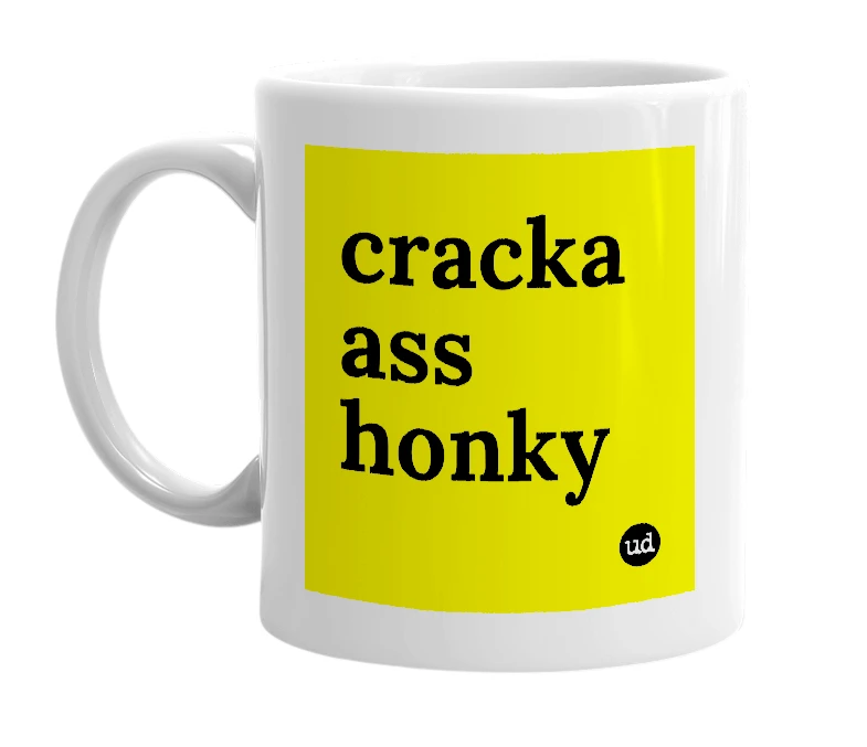 White mug with 'cracka ass honky' in bold black letters