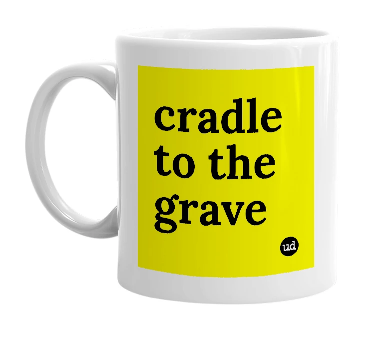 White mug with 'cradle to the grave' in bold black letters