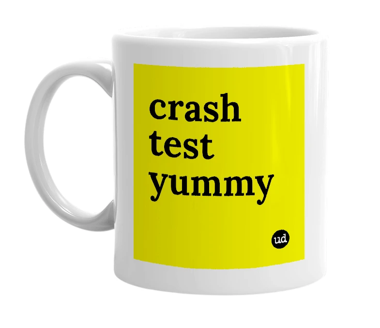 White mug with 'crash test yummy' in bold black letters