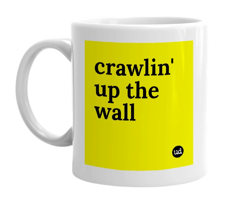 White mug with 'crawlin' up the wall' in bold black letters