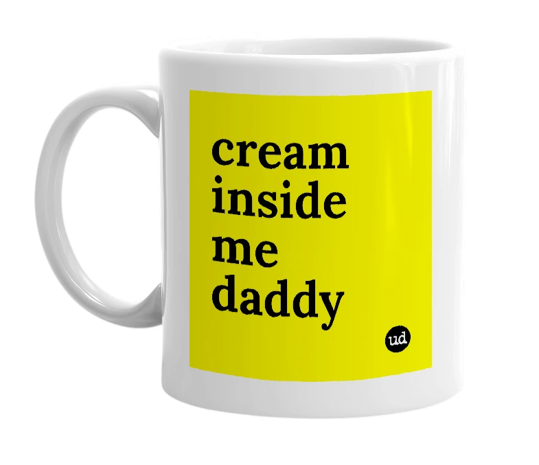White mug with 'cream inside me daddy' in bold black letters