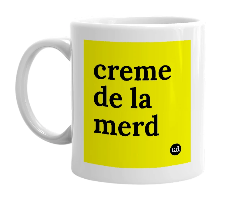 White mug with 'creme de la merd' in bold black letters