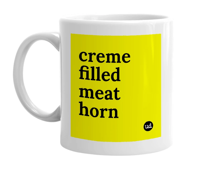 White mug with 'creme filled meat horn' in bold black letters