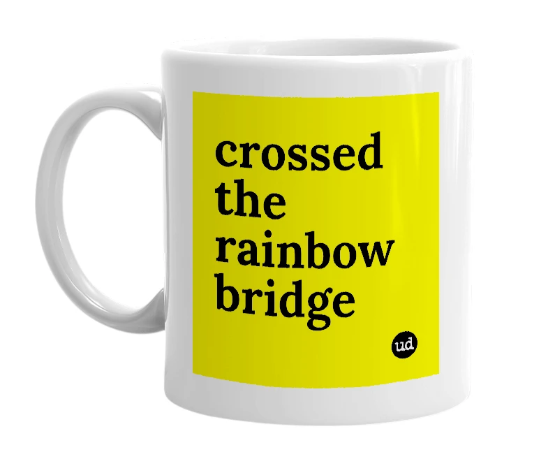 White mug with 'crossed the rainbow bridge' in bold black letters