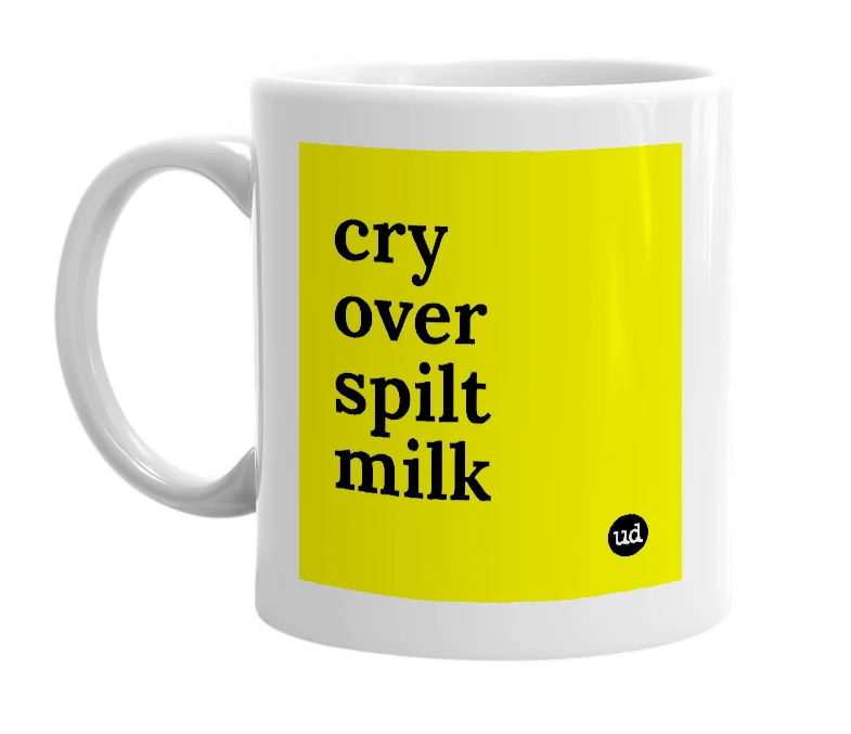 White mug with 'cry over spilt milk' in bold black letters