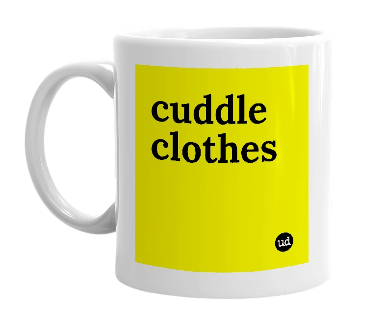 White mug with 'cuddle clothes' in bold black letters