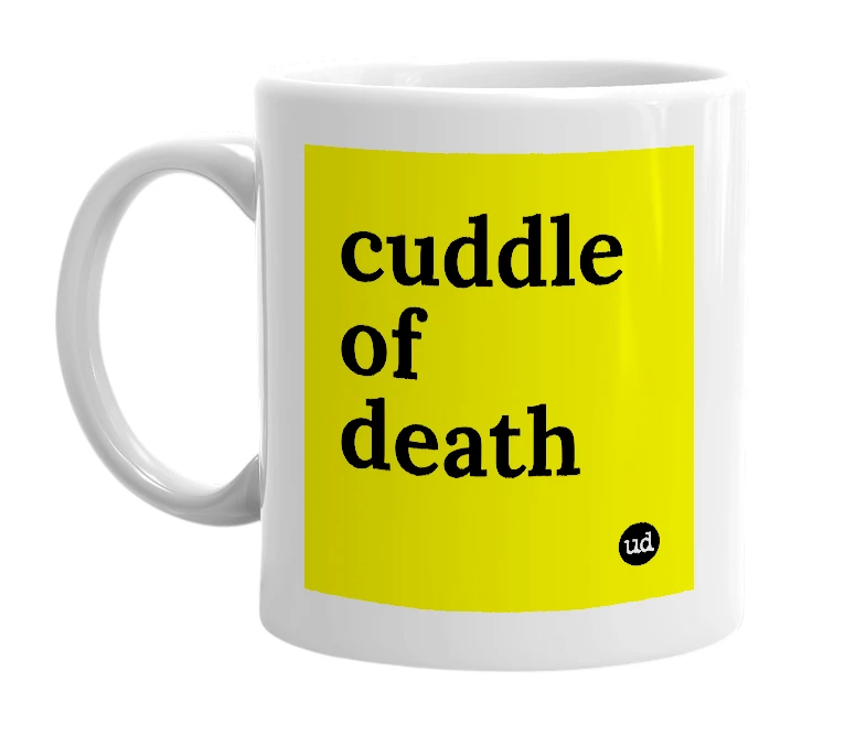 White mug with 'cuddle of death' in bold black letters