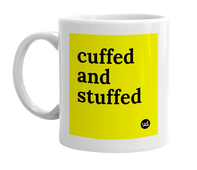 White mug with 'cuffed and stuffed' in bold black letters