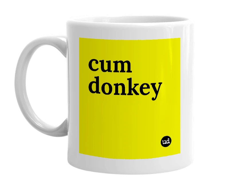 White mug with 'cum donkey' in bold black letters