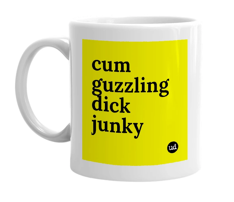 White mug with 'cum guzzling dick junky' in bold black letters