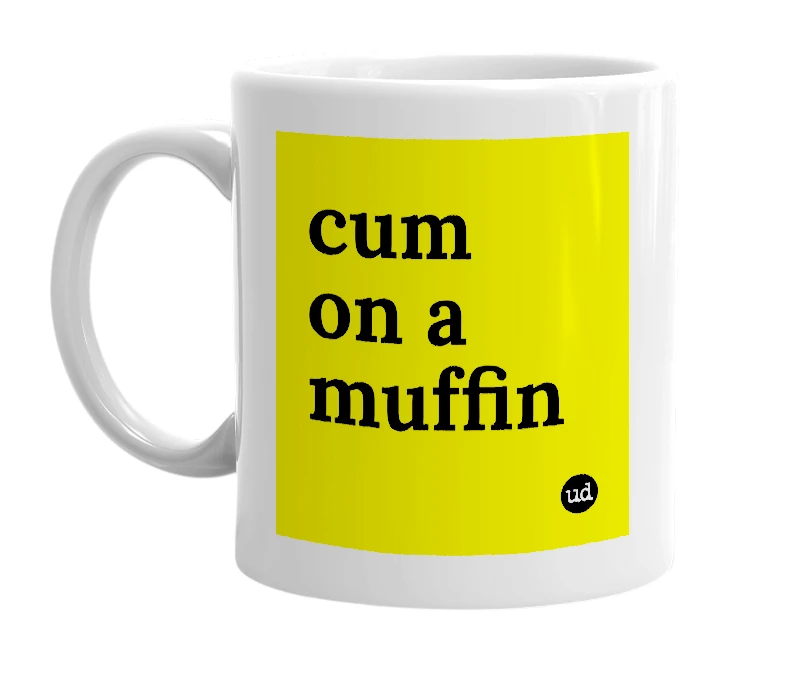 White mug with 'cum on a muffin' in bold black letters