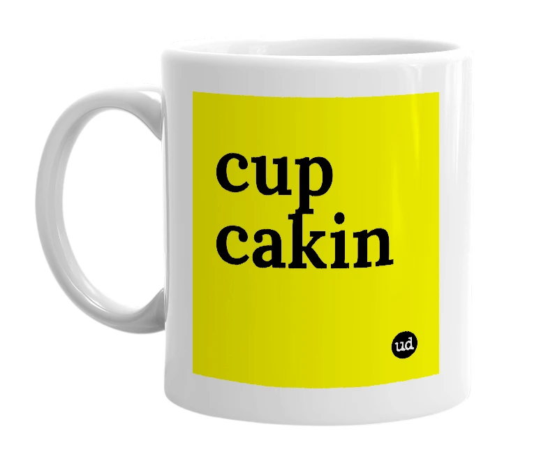 White mug with 'cup cakin' in bold black letters