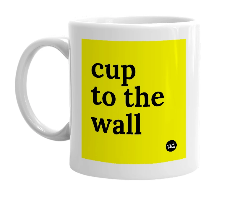 White mug with 'cup to the wall' in bold black letters