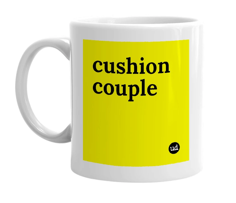 White mug with 'cushion couple' in bold black letters