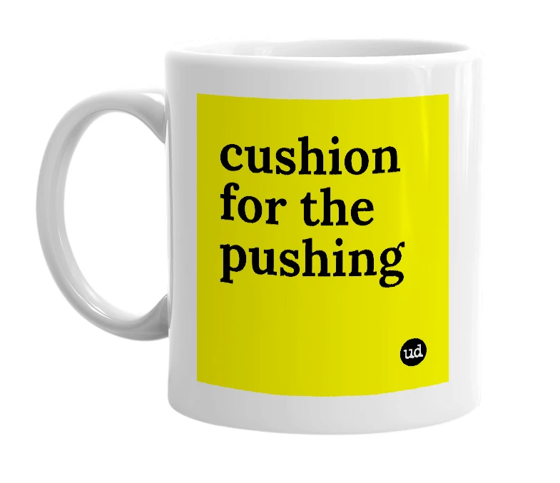 White mug with 'cushion for the pushing' in bold black letters