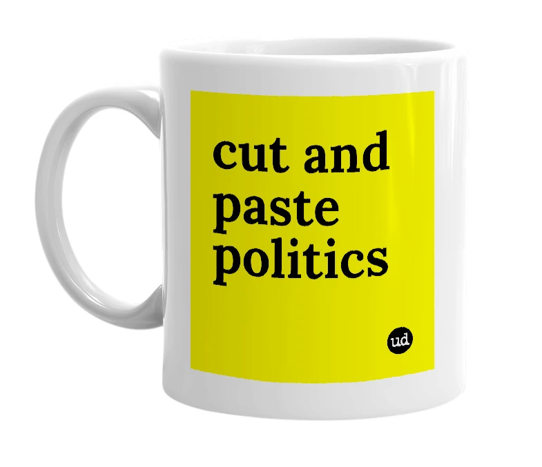 White mug with 'cut and paste politics' in bold black letters