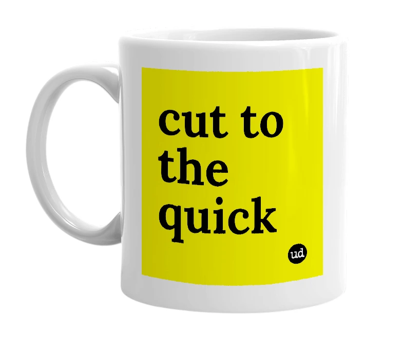 White mug with 'cut to the quick' in bold black letters