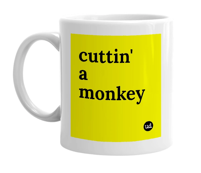White mug with 'cuttin' a monkey' in bold black letters