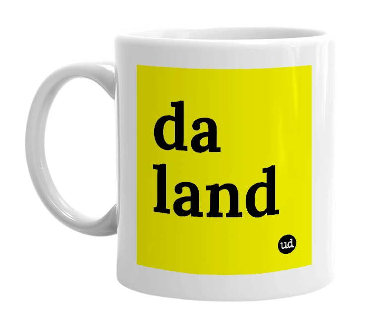 White mug with 'da land' in bold black letters