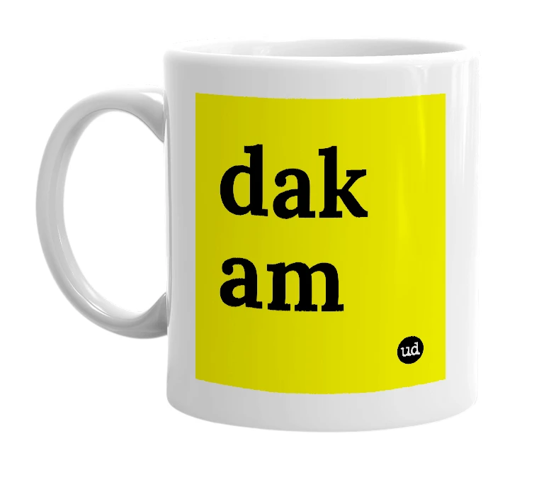 White mug with 'dak am' in bold black letters