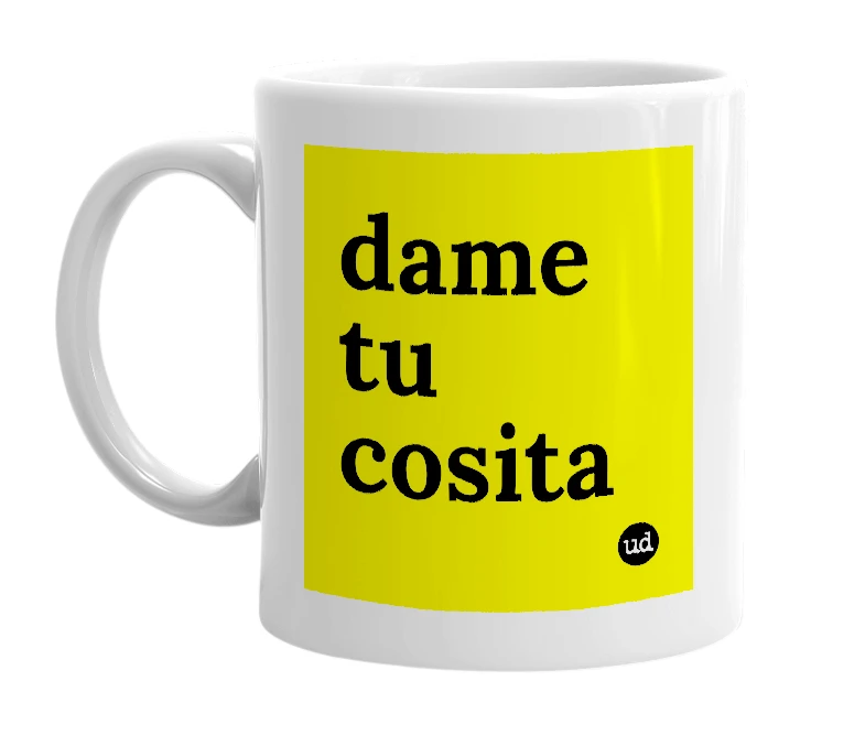 White mug with 'dame tu cosita' in bold black letters