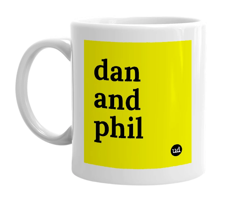 White mug with 'dan and phil' in bold black letters