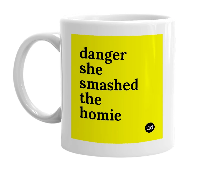 White mug with 'danger she smashed the homie' in bold black letters