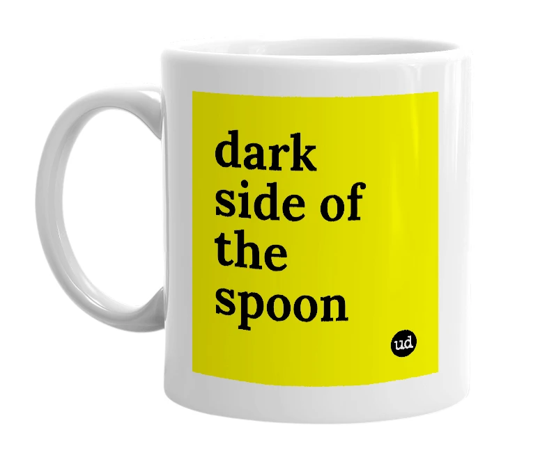 White mug with 'dark side of the spoon' in bold black letters