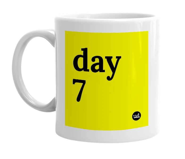 White mug with 'day 7' in bold black letters