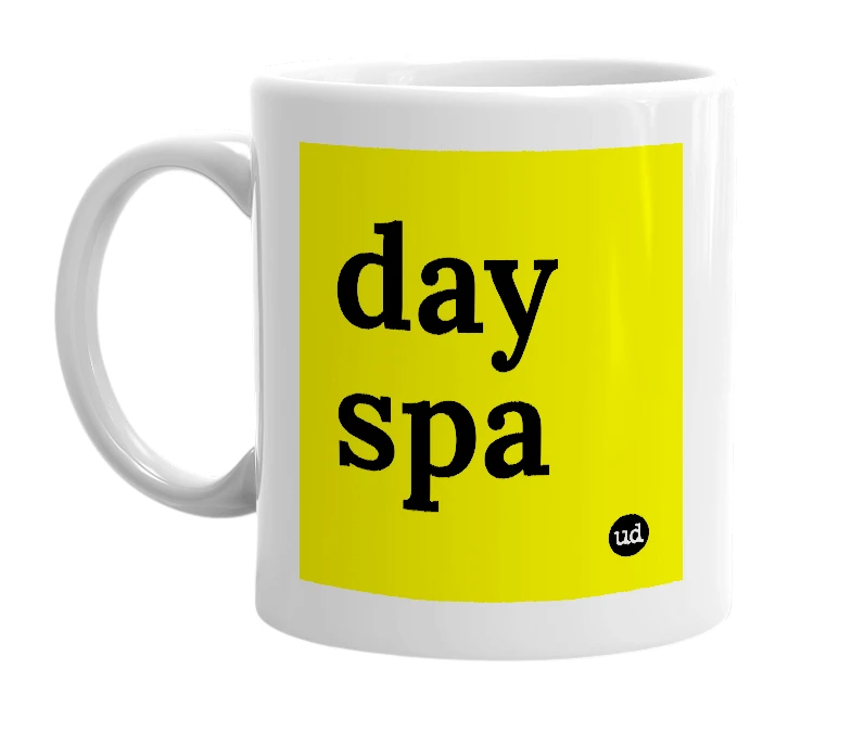 White mug with 'day spa' in bold black letters