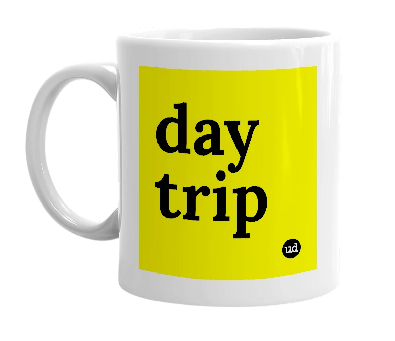 White mug with 'day trip' in bold black letters