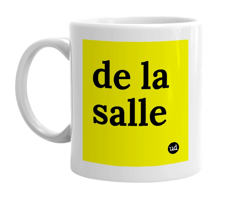 White mug with 'de la salle' in bold black letters