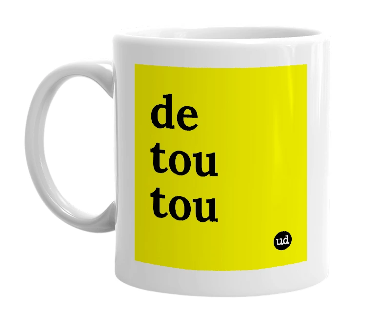 White mug with 'de tou tou' in bold black letters