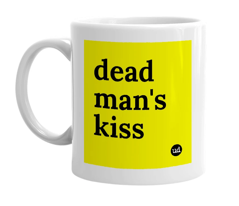 White mug with 'dead man's kiss' in bold black letters