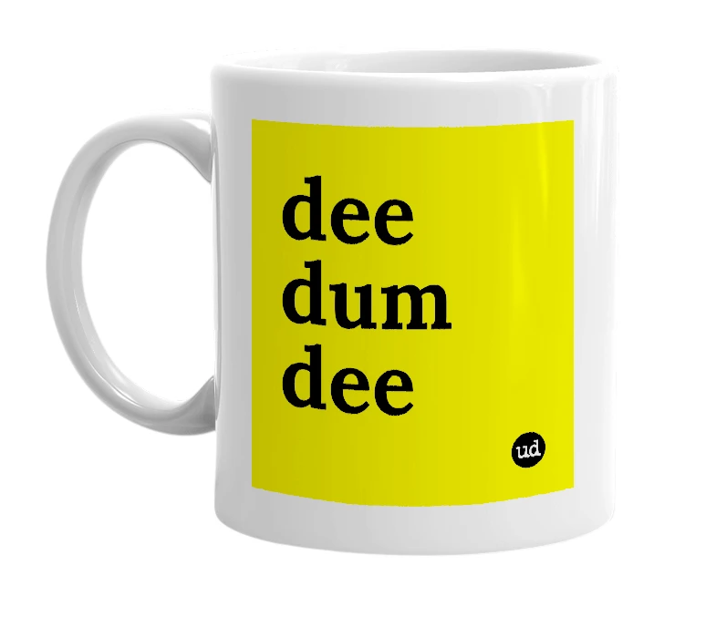 White mug with 'dee dum dee' in bold black letters