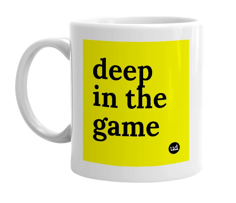 White mug with 'deep in the game' in bold black letters