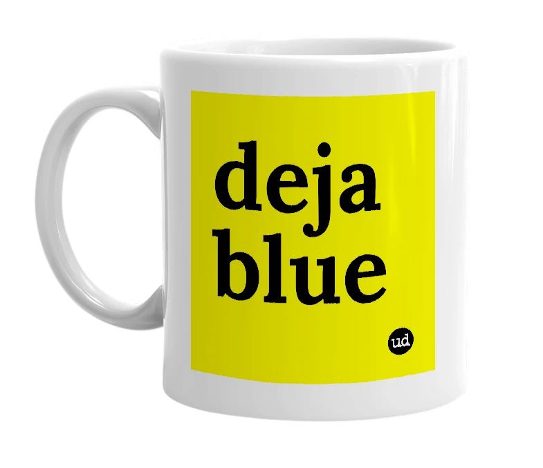 White mug with 'deja blue' in bold black letters