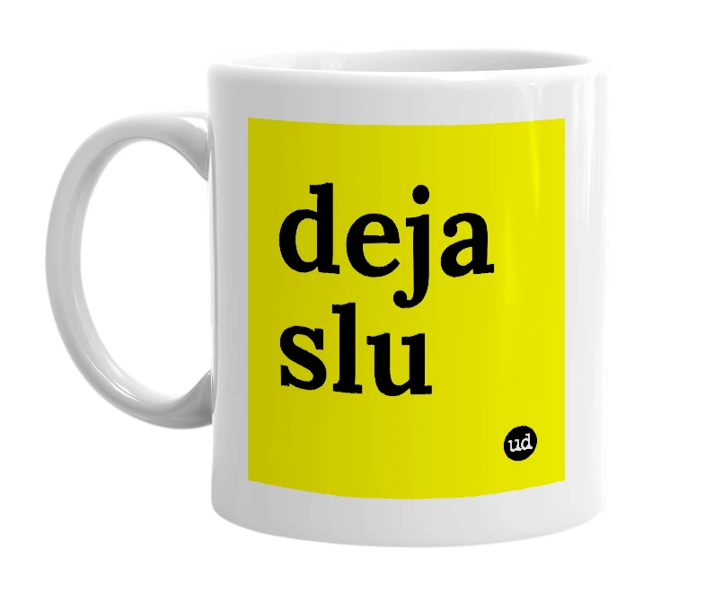 White mug with 'deja slu' in bold black letters