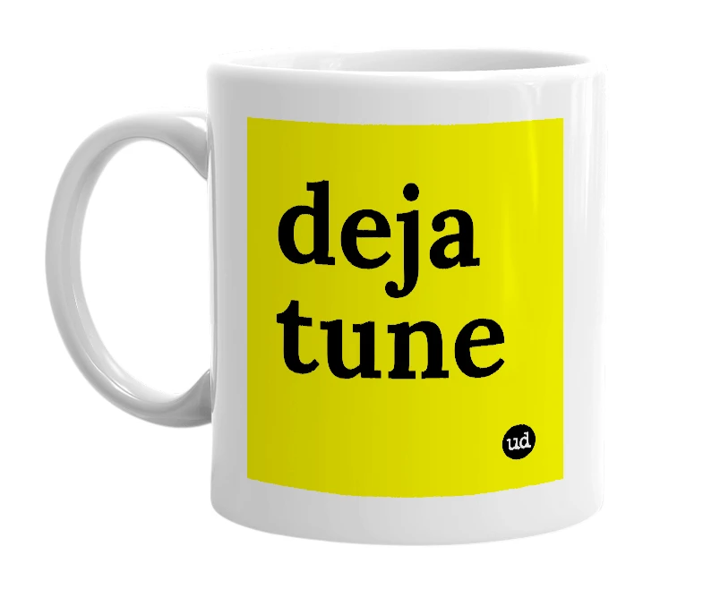 White mug with 'deja tune' in bold black letters