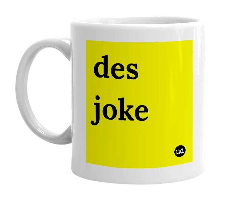 White mug with 'des joke' in bold black letters
