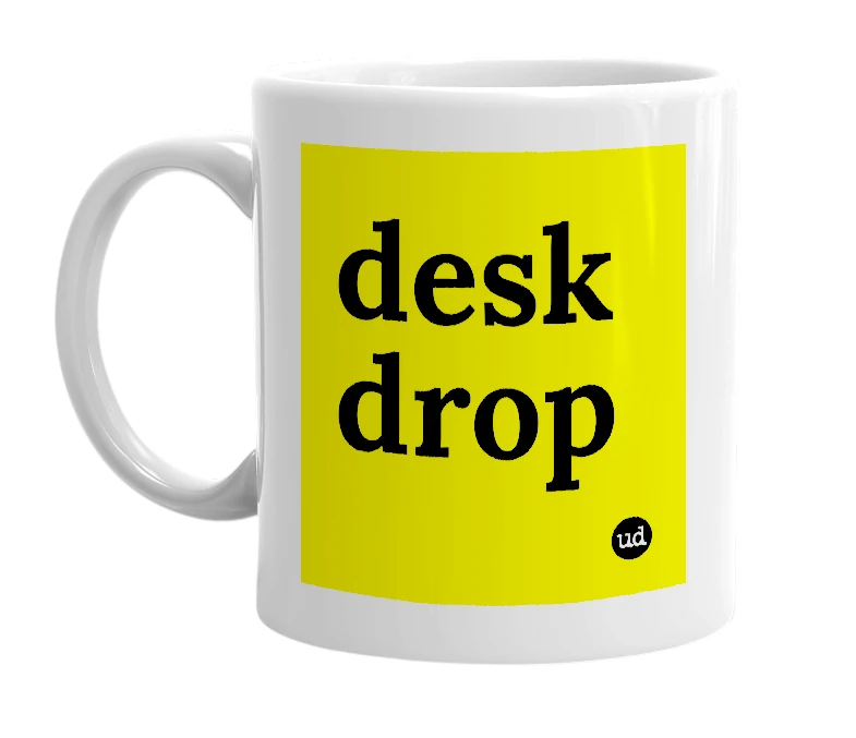 White mug with 'desk drop' in bold black letters